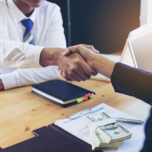 two people shaking hands. 